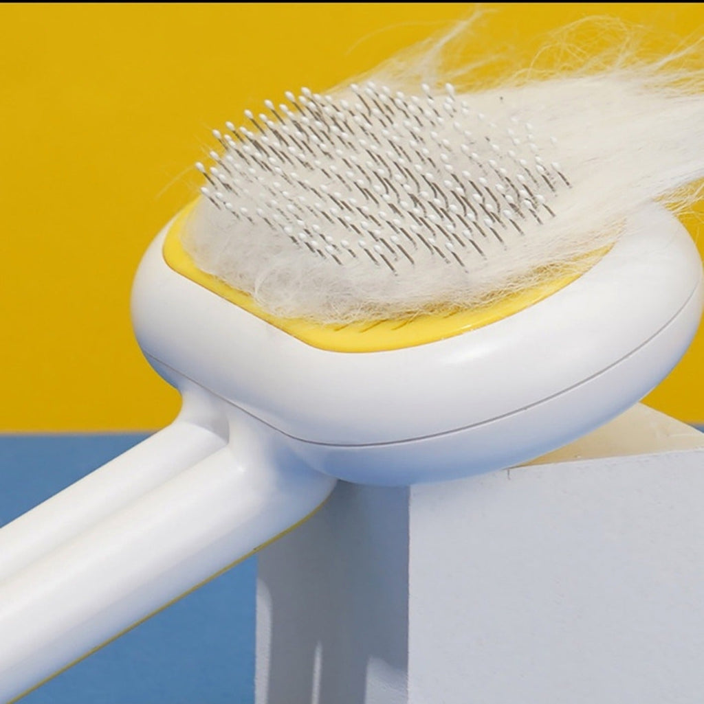 White and yellow pet brush close-up — supplier image