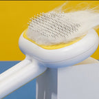 White and yellow pet brush close-up — supplier image